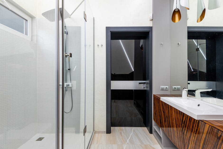 Glass shower enclosure replacing an old bathtub